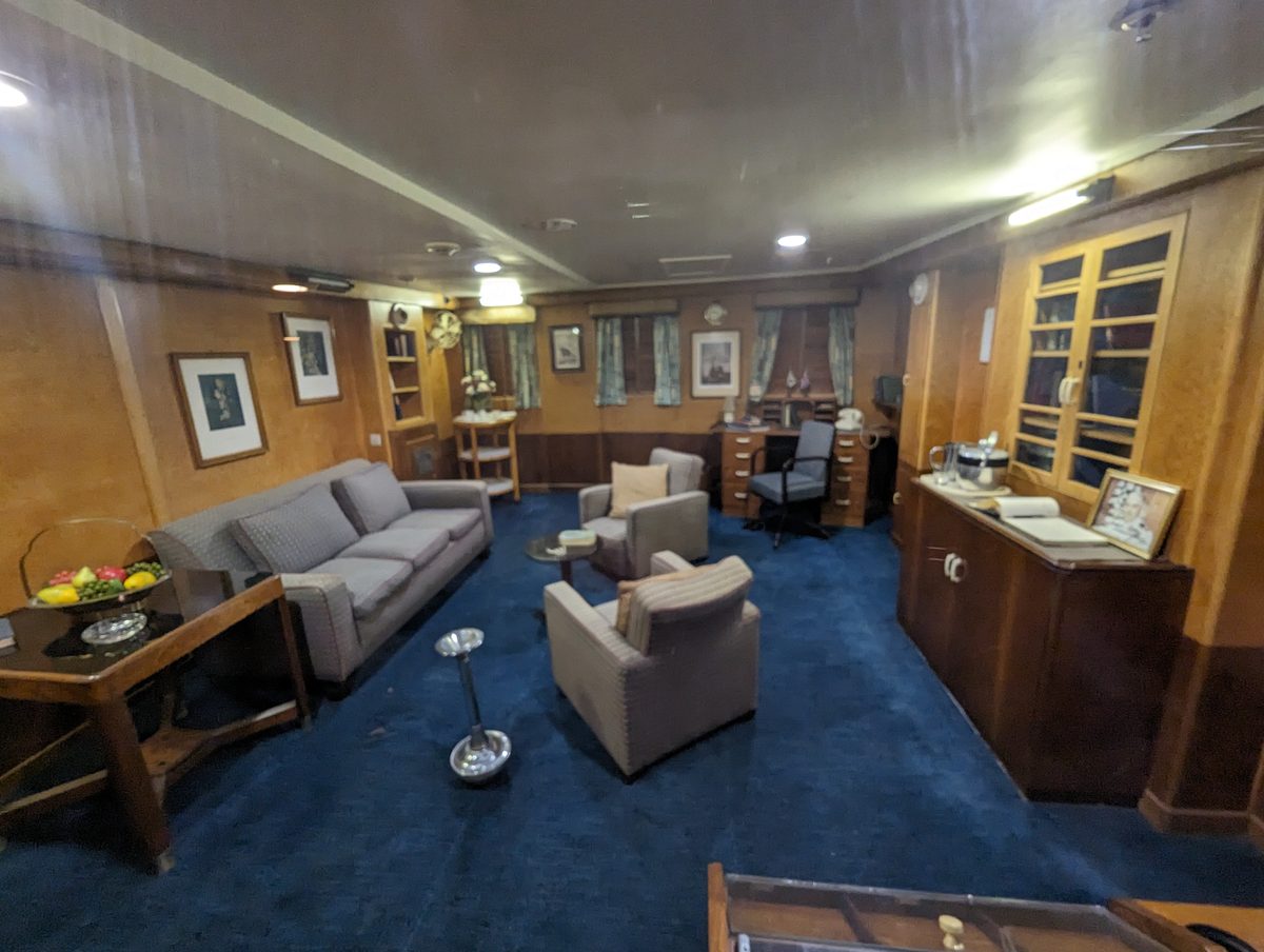 The Captain's Day Cabin on the Queen Mary — a preserved 1930s stateroom with Art Deco furnishings and blue carpet