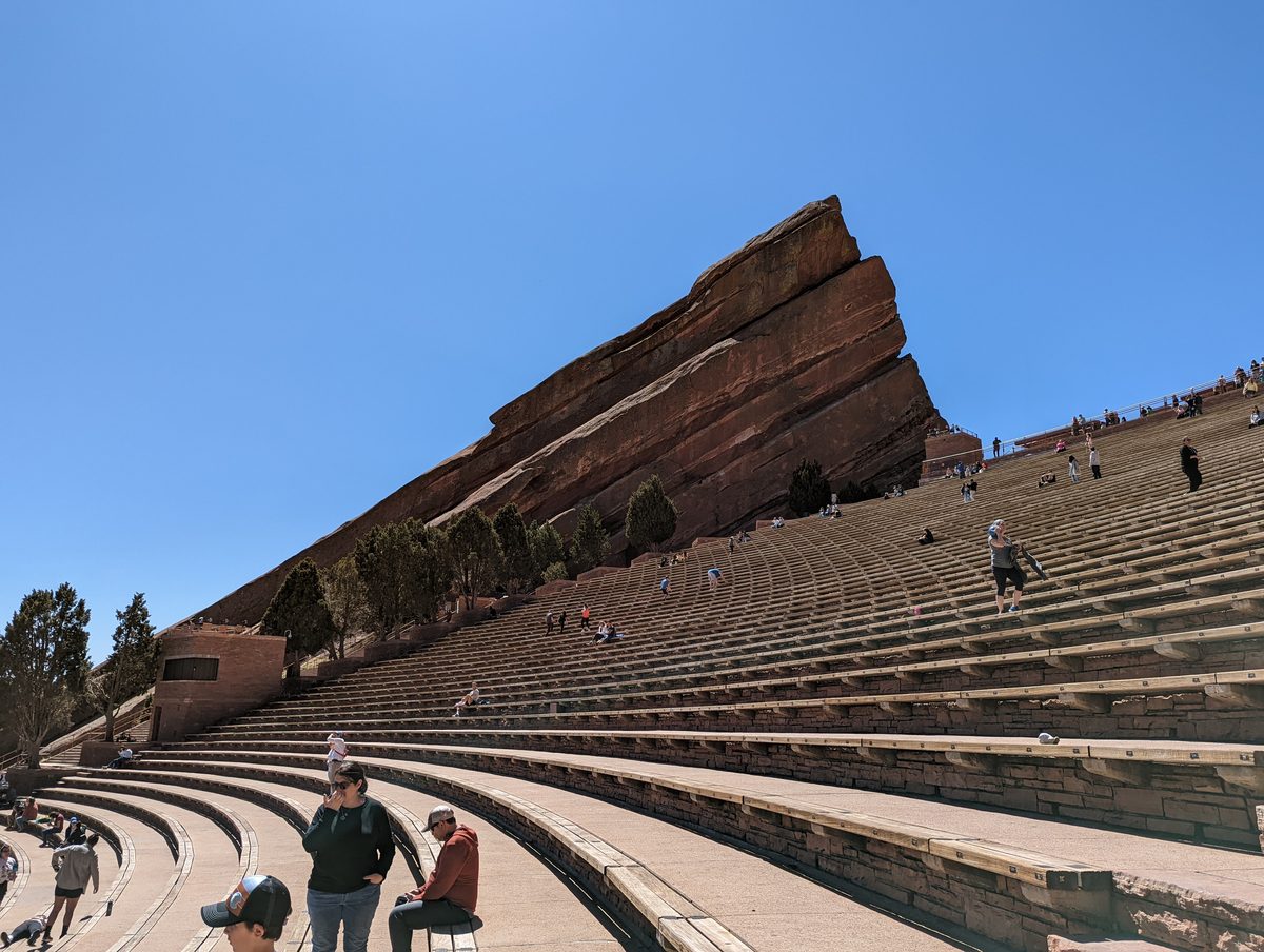 The iconic view of Ship Rock towering over the empty amphitheater seating