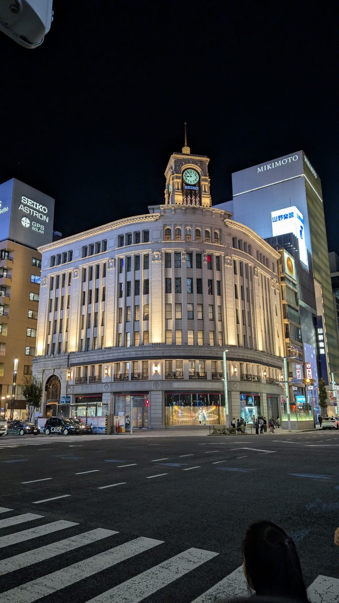 The illuminated Wako building and its Seiko clock tower at night