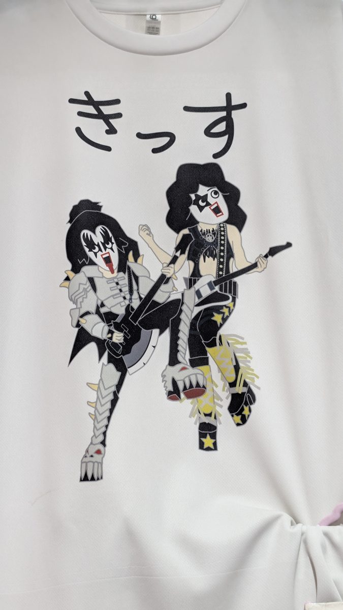 A KISS band T-shirt with the name written in katakana hanging in a Takeshita Street shop
