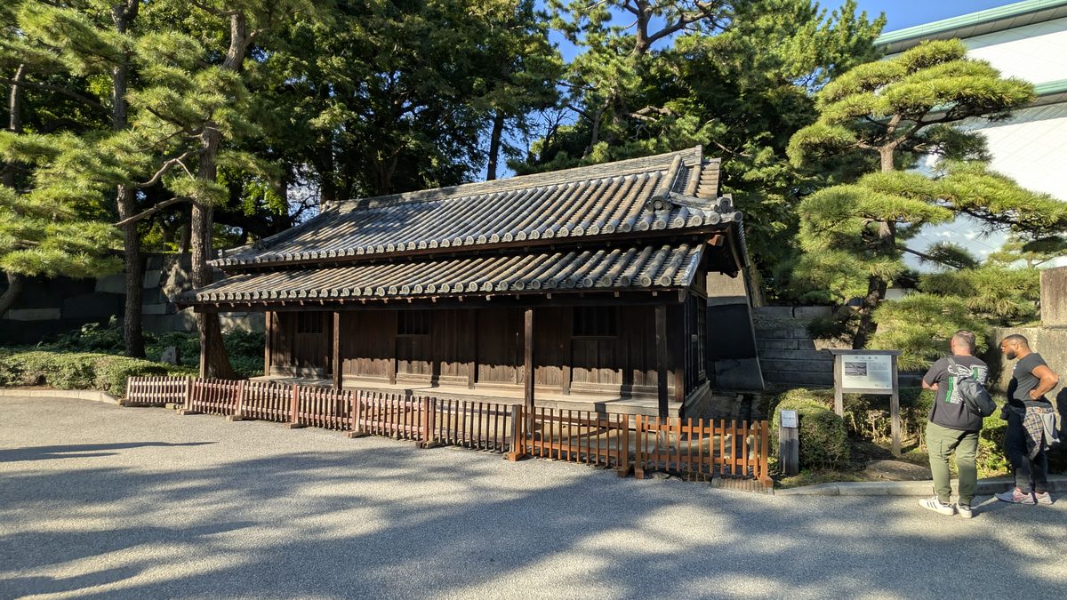 A surviving traditional wooden guardhouse with a tiled roof in the East Gardens