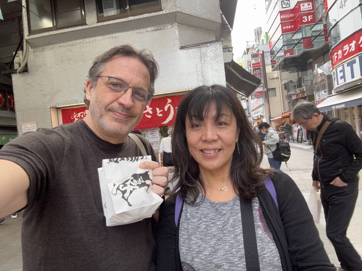 Eddy and Ako taking a selfie in a covered shopping arcade
