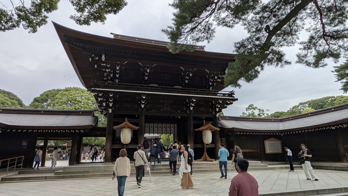 The great Romon gate of Meiji Shrine with paper lanterns and visitors